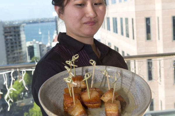 The famous Rydges pork belly served by Rydges staff
